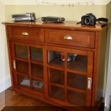 F57. Glass front cabinet with 2 drawers. 39”h x 47”w x 16”d - $125 